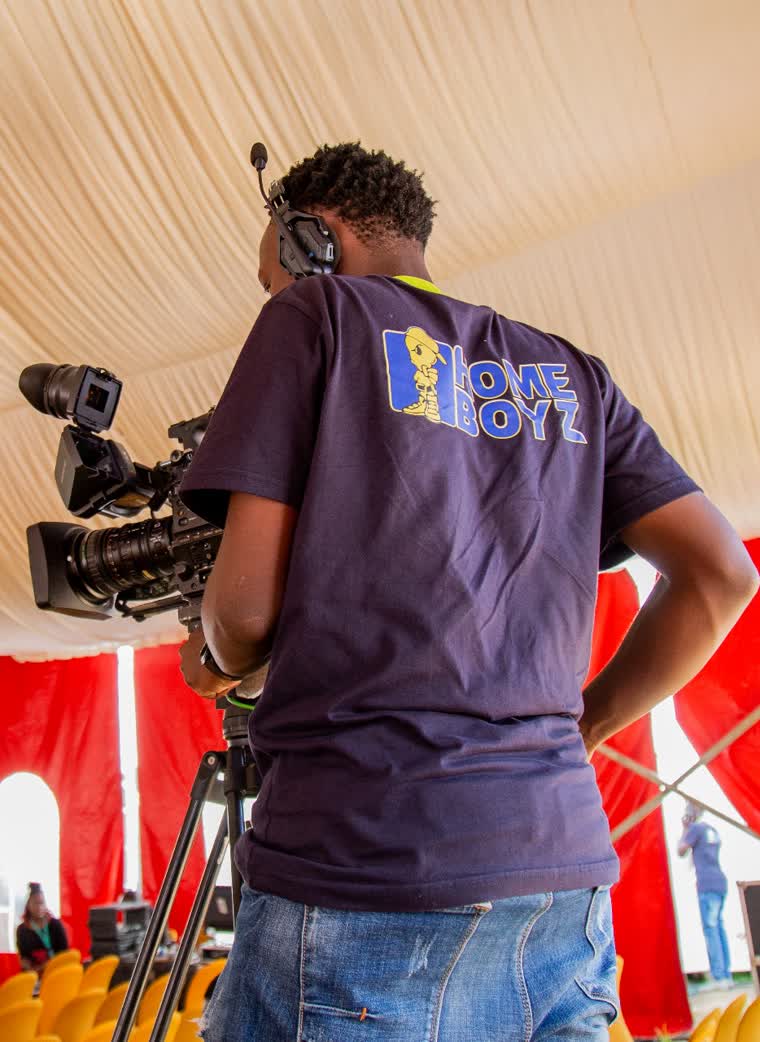 Homeboyz TV camera operator working from behind the camera