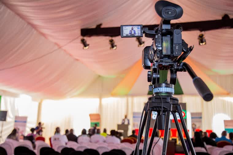 Camera rig framing a conference floor