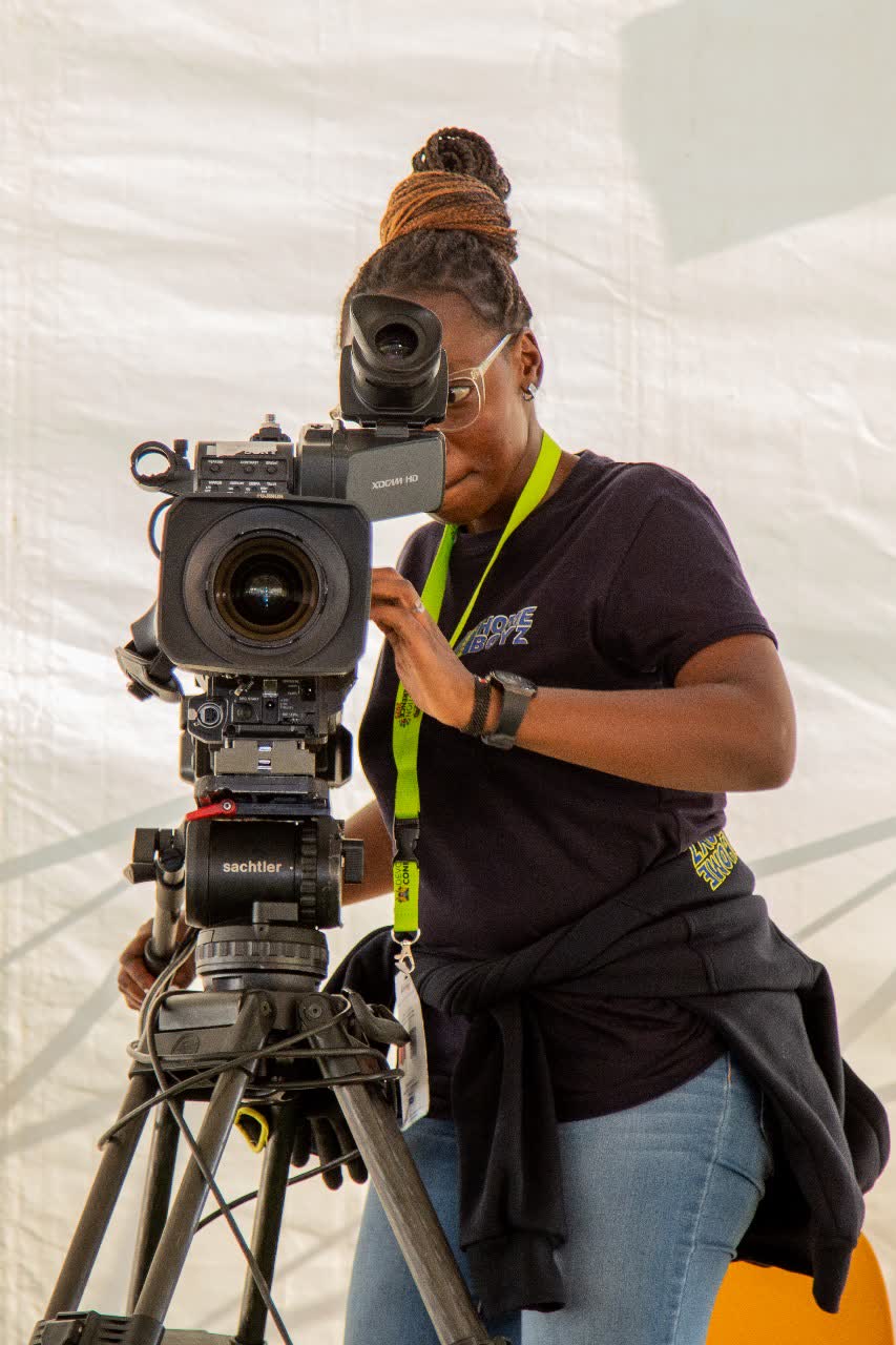 Camera operator at an XDCAM viewfinder during a live broadcast