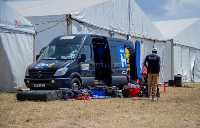 The HBTV outside broadcast van with gear laid out beside event marquees