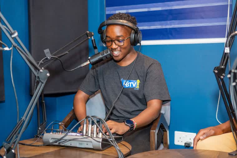 Sound engineer working the audio console during transmission
