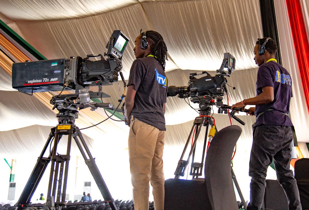 Homeboyz TV camera operators working matched broadcast cameras on a riser