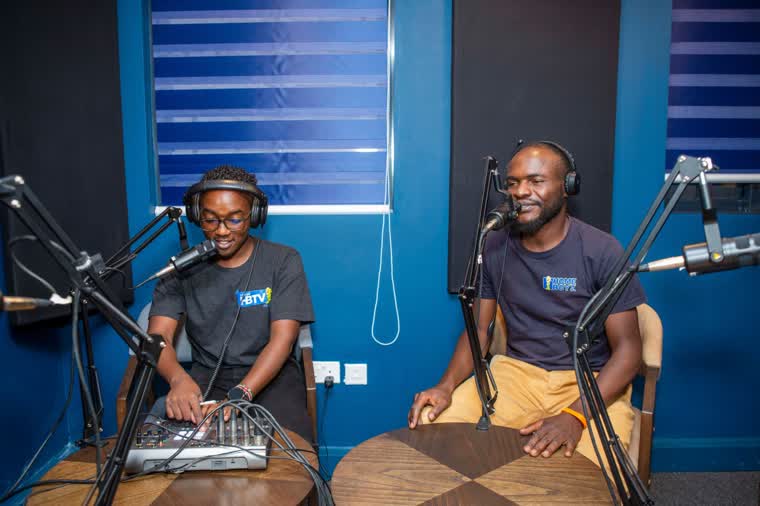 Two presenters recording in the Homeboyz TV studio